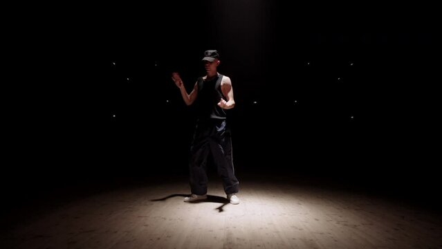 professional choreographer and dancer man is dancing on scene or in rehearsal room