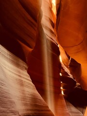 Vertical amazing shot of an inside  view of  Antelope Canyon with sandstones and sunlight in
