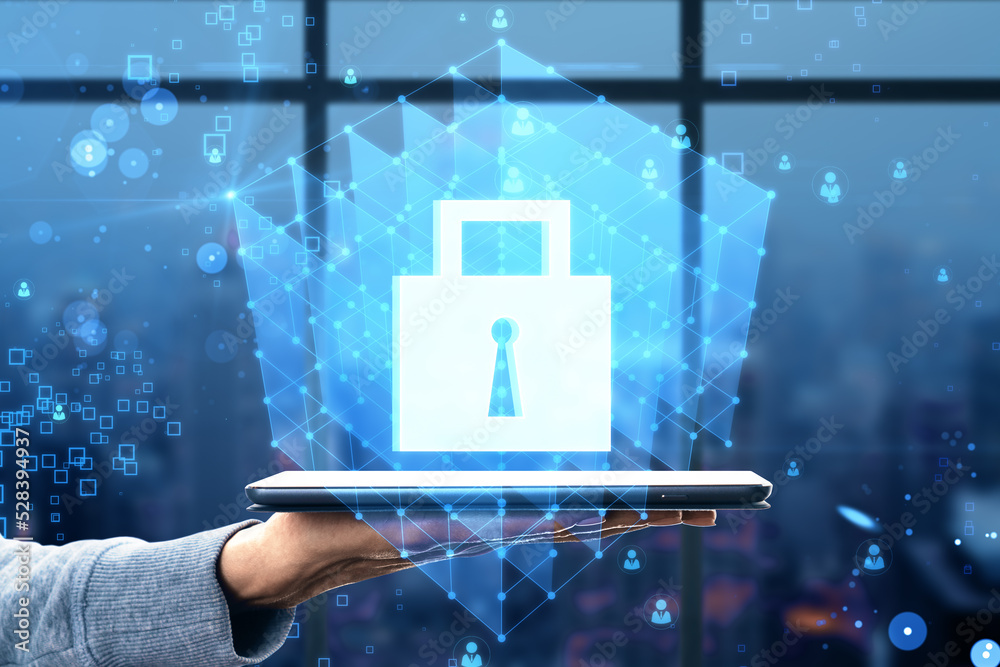 Aufkleber close up of hand holding tablet with creative glowing blue padlock grid hologram on blurry bokeh bac
