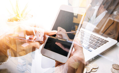 Woman accountant use calculator and computer with holding pen on
