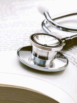 Vertical Closeup Of A Stethoscope On A Medical Book