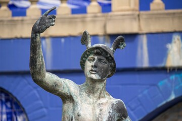 Sculpture of the ancient Greek god Hermes in helmet with wings, God of trade, merchants, shepherds
