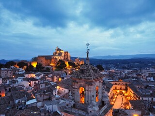 Beautiful evening view of the Spanish town Caravaca de la Cruz with street lights from above