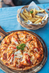 Homemade chicken ham cheese barbeque pizza with chili served on wooden tray