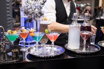 Bartender making cocktail at bar counter. Selective focus.