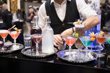 Bartender making cocktail at bar counter. Selective focus.
