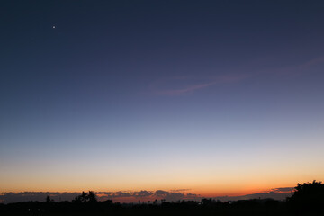 Twilight line of evening sky sunset light and silhouette, shadow darkness meadow, tree, Beautiful nature abstract background