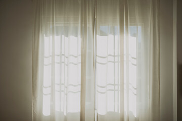 White color curtains on window at home