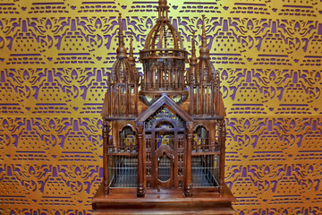 wooden bird cage in the shape of a mosque