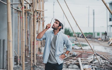 American architects do industrial construction.The foreman wears a safety helmet.Inspector of production machinery.