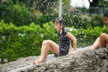 Group of kids playing on muck in the raining day