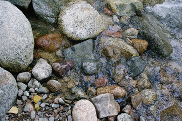 Stones in river water close up photo 