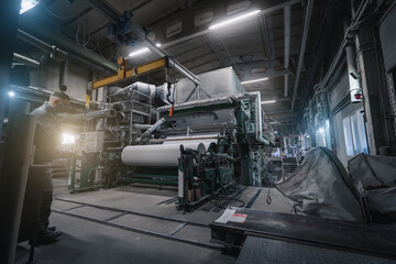Naklejka na ściany i meble Paper production machine in wastepaper recycling factory. Paper and pulp mill.