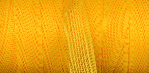 Yellow plastic nylon netting material as abstract background - obrazy, fototapety, plakaty