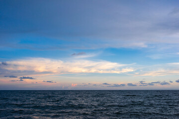 seascape with sunset against blue sky