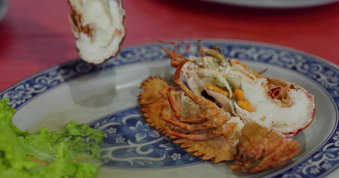 Steamed lobster on the plate in restaurant