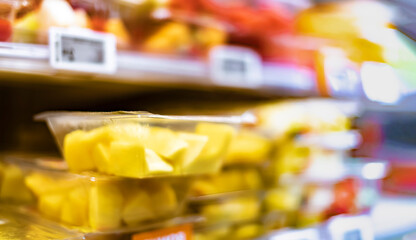 Packages with fruits displayed in a commercial refrigerator