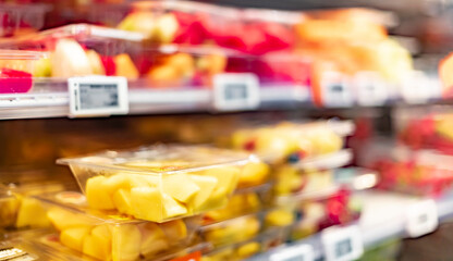 Packages with fruits displayed in a commercial refrigerator