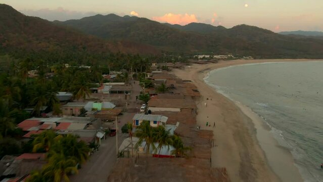 Beach In Maruata, Michoacan, Mexico During Sunset - aerial drone shot