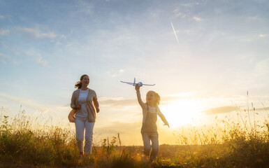 Happy family at sunset