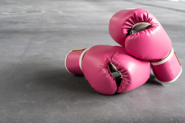 pink boxing gloves for girl and woman fight with copy space.