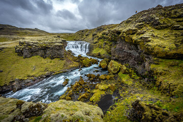 Naklejka na ściany i meble Waterfall in mountains, Iceland