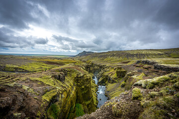 Fototapeta na wymiar Waterfall in mountains, Iceland