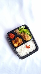 nasi kotak ayam goreng. rice box fried chicken