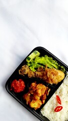 nasi kotak ayam goreng. rice box fried chicken