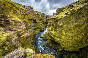 Waterfall in mountains, Iceland