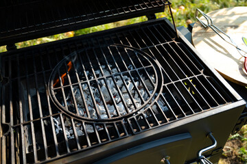 burning charcoal on the grill