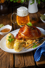 pork knuckle with sauerkraut and sweet mustard