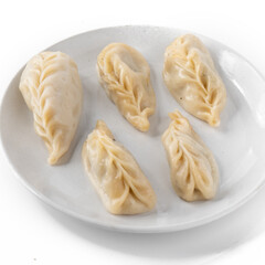 Traditional Dumpling Momos Served on white plate.