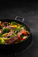Beef with vegetables. Prepared in a wok.