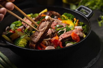 Beef with vegetables. Prepared in a wok.