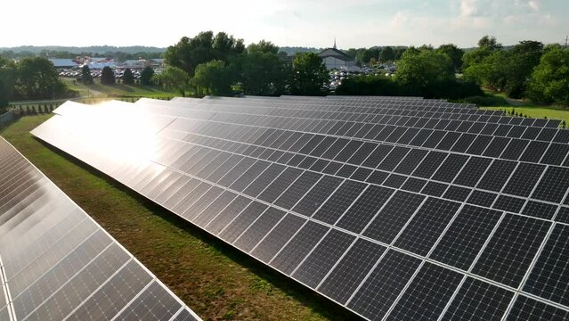 Solar power theme. Renewable green energy. Sunshine reflects sunlight. Aerial view.