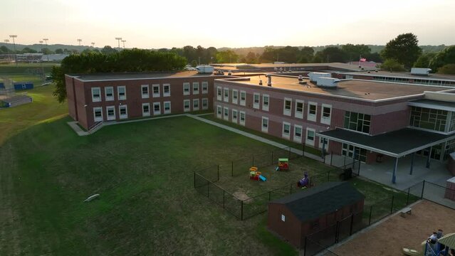 Aerial of American school building at summer sunset. Education theme in USA.