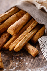 Traditional homemade baked snack in form of long bread sticks.
