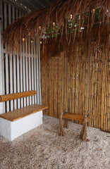 Bamboo wood to arranged wall with wooden swing       