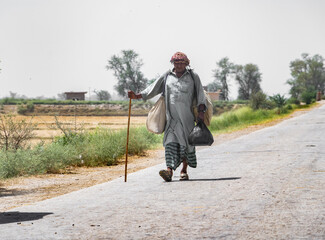 a villager is walking on a street cause of a transportation shortage 