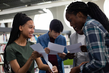 High school students opening their exam results