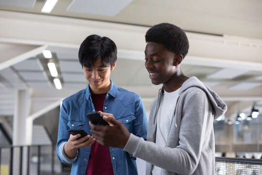 Students looking at a smartphone at break time