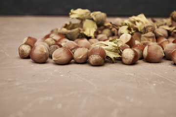 hazelnuts scattered on the table close-up copy space