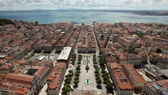 Aerial drone view of Baixa District in Lisbon, Portugal with major landmarks visible