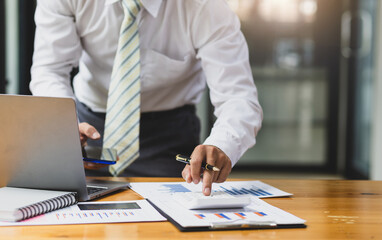 Businessman or accountant working Financial investment on calculator, calculate, analyze business...