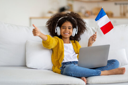 Happy Black Girl Using Laptop, Showing French Flag