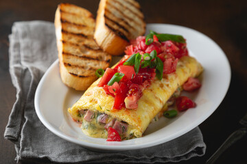 Omelette stuffed with ham cheese and dill