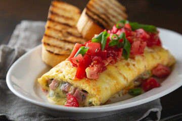Omelette stuffed with ham cheese and dill