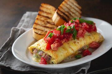 Omelette stuffed with ham cheese and dill