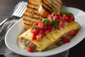 Omelette stuffed with ham cheese and dill